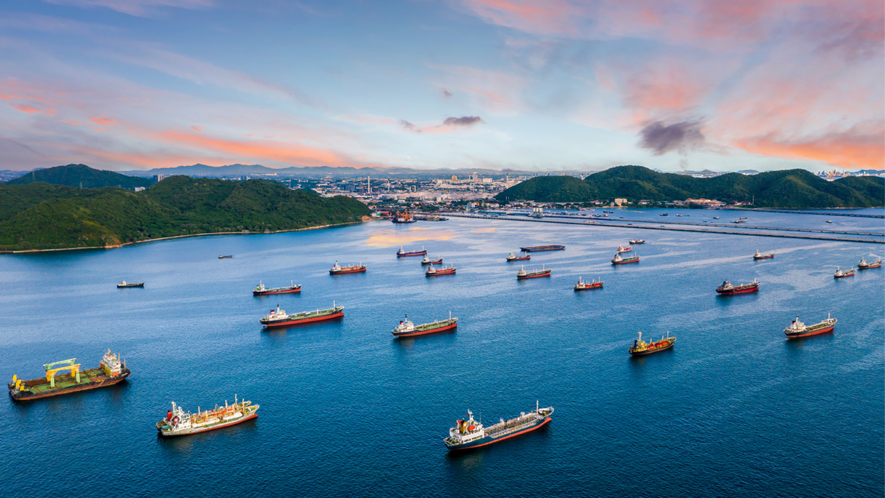 Many ships lining up and waiting to dock