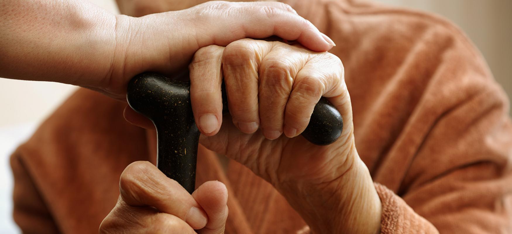 Elderly person with cane.