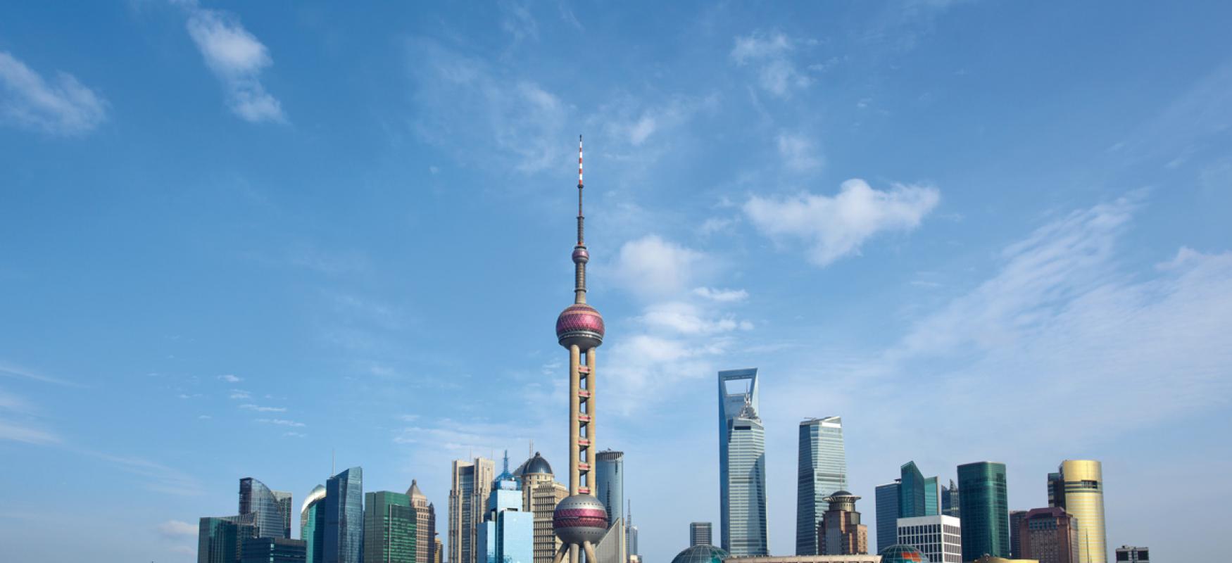 Shanghai skyline by day seen from the sea.