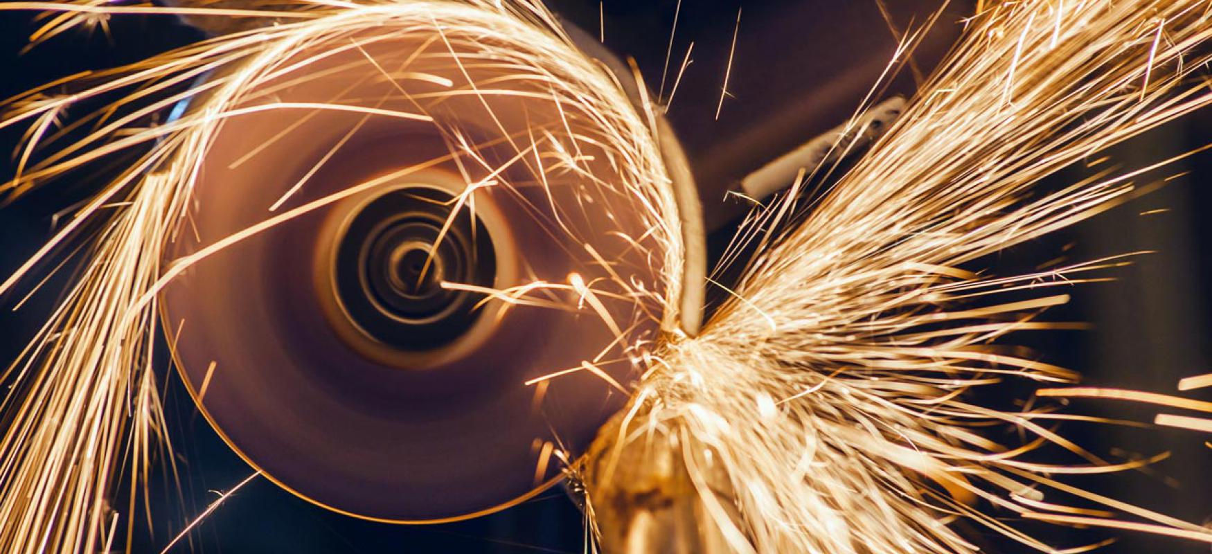 Angle grinder with sparks flying.