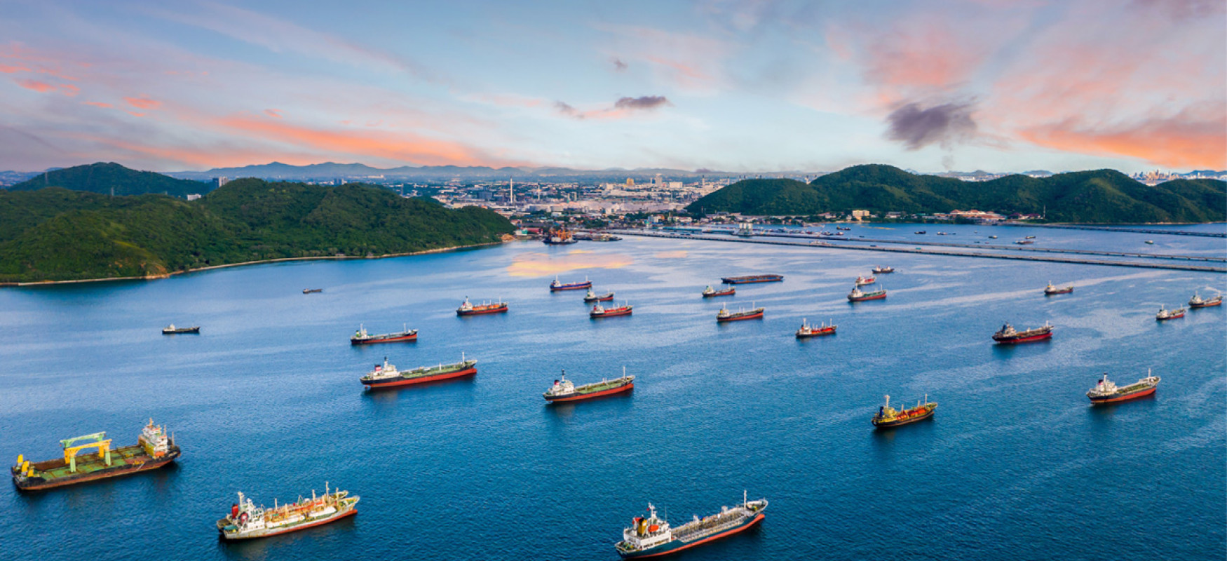 Many ships lining up and waiting to dock