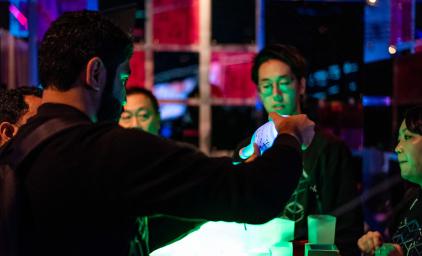 People standing and looking at inventions at Slush in Helsinki 2018