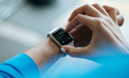 Person checking his Apple watch. Photo: Luke Chesser