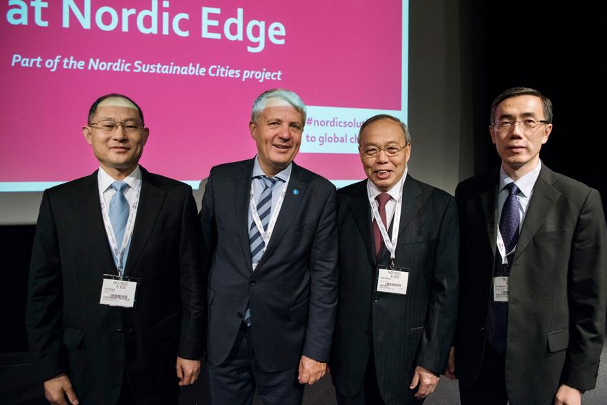 A group photo of Dr. Pengqi Lu, Mr. Dagfinn Høybråten, Professor Xinli Zheng and Mr. Liu Weimin.