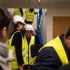 A Chinese delegation wearing yellow vests and hard hats at a sight visit in Norway.