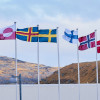 All the Nordic flags flying in the wind on flagpoles